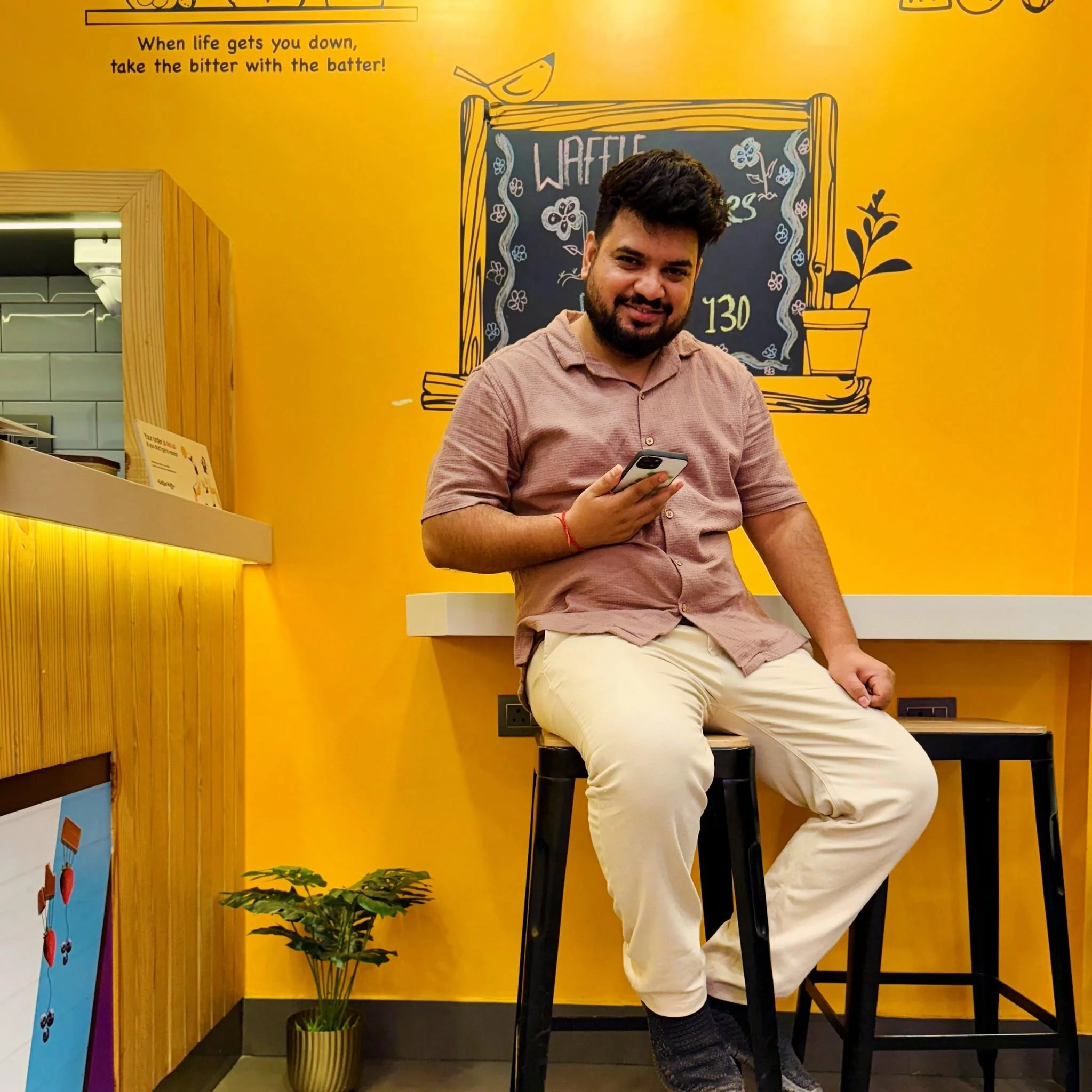 Mukesh Kumar seated in a café
